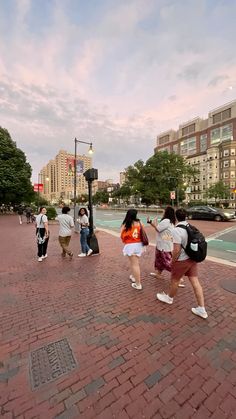 some people are walking down the street together