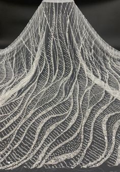 an artistic image of a mountain made out of white thread