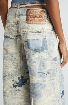 Glimpses of contrasting denim patches peek through the ragged, tattered surface of these wide-leg nonstretch jeans detailed with a slim D-ring belt. 28" inseam; 25" leg opening; 9 1/2" front rise; 12 1/2" back rise (size 34) Zip fly with button closure Five-pocket style Removable belt 100% cotton Machine wash, line dry Made in Italy Designer Clothing Sashiko Jeans, Acne Jeans, Jeans Street Style, Denim Wide Leg, Ring Belt, Denim Ideas, Denim Patches, Patched Jeans, Denim Trends