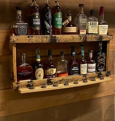 a wooden shelf filled with bottles of liquor