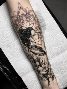 a woman's leg with flowers on it and the word interest written in black ink