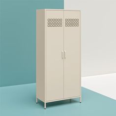 a tall white cabinet sitting on top of a blue floor