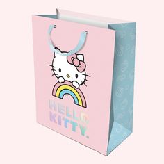 A light pink and blue hello kitty bag with holographic lettering that reads Hello Kitty Gift Bags, Hello Kitty Rainbow, Hello Kitty Gifts, Rainbow Sky, Birthday Wrapping Paper, Hello Kitty Birthday, Something Big, Bag Set, Medium Bags