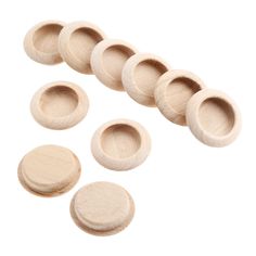 six wooden knobs with holes for sewing and other craftsing items on a white background