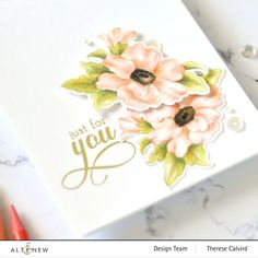 a close up of a card with flowers on it