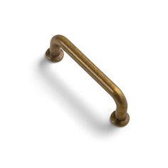 an antique brass door handle on a white background