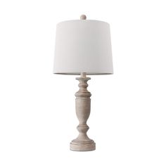 a wooden table lamp with a white shade