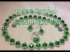 an emerald necklace and earring set with diamonds