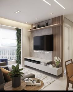 a living room filled with furniture and a flat screen tv on top of a wall