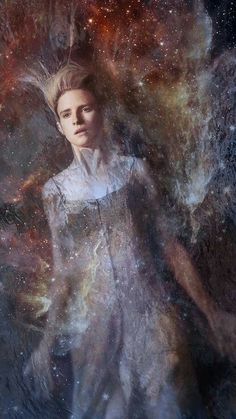 a woman standing in front of a space filled with stars