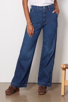 Add a ‘70s-inspired flair to your fall wardrobe with these wide leg jeans by AMO. This high-rise silhouette features pintuck detailing down the front and an elongating full-length leg that pairs perfectly with booties, clogs, and mules. 92% Cotton, 6% Elastomultiester, 2% Elastane Denim Trip Clothes, Clogs And Mules, Brand Style Guide, 70s Inspired, Vintage Inspired Design, Shoes With Jeans, Work Fashion, Fall Wardrobe, Winter Style