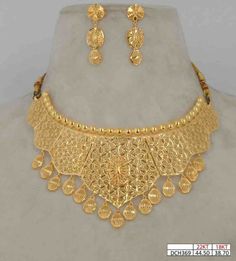 a gold necklace and earring set