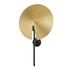 a black and gold lamp on a white background