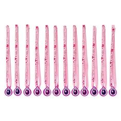 the pink toothbrushes are lined up in a row