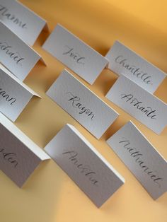 place cards with names on them sitting on a table