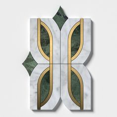 an art deco tile design with gold and green accents on a white background, in the shape of a rectangle