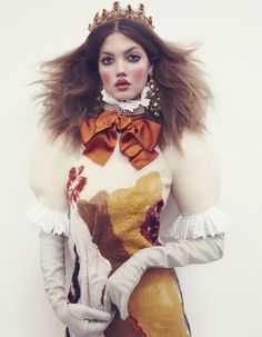 a woman with long hair wearing a dress and gloves