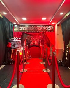 a red carpeted entrance way leading into a party