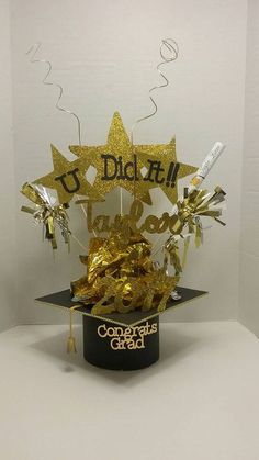 a black hat with gold foil stars and confetti streamers in it that says do not touch