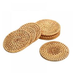 three round wicker coasters sitting on top of each other