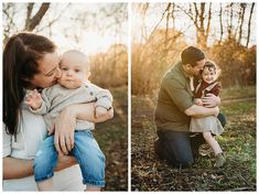 a man and woman holding a baby in their arms while the sun is setting behind them