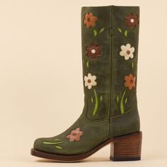 These cowgirl boots feature a dark green hue, square toe design, block heel for comfort, and blossom detailing around the mid-calf area, blending classic Western style with contemporary flair. Color: Dark green Heel Type: Block heel Heel Height: 2.36" / 60 mm approx Shaft Height: 11.81'' / 300 mm approx Product measurements were taken using size 8. Please note that measurements may vary by size. Toe: Square toe Flower blossom design Pull-on design Handcrafted US sizing. Fits true to size. Western Style Mid-calf Boots With Block Heel For Spring, Spring Mid-calf Boots With Stacked Heel, Wide Calf Mid-calf Boots With Stacked Heel For Spring, Green Casual Heeled Boots With Round Toe, Casual Green Round Toe Heeled Boots, Green Knee-high Heeled Boots For Fall, Green Boots With Stacked Heel And Round Toe, Green Block Heel Boots For Fall, Green Knee-high Heeled Boots For Spring