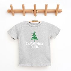 Looking for a cute tee for your kids? We have the perfect Christmas Cutie Tree Glitter graphic tee addition to their closet! Also available in youth tees. NOTE: This design is not real glitter, it is only printed to look like glitter. Trending Graphic Tees, Girls Fleece, Top Graphic Tees, Kids Outfits Girls, Toddler Tees, Toddler Girl Outfits, Perfect Christmas, Tee Shop, Toddler Outfits