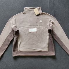 Women's Nike Acg Therma-Fit Wolf Tree Polartec Fleece Pullover Size L (Moon Fossil/Olive Grey/Summit White). Brand New With Tags, Never Tried On. Comes From A Smoke-Free Home. Fast Free Shipping Via Usps Priority Mail. Measurements (Approx.) Chest Across 25 Inches Length 24inches Sleeves 22 Inches Midweight Fleece Long Sleeve Tops, White Ski Jacket, Black Winter Jacket, Brown Zip Ups, Nike Brown, Snow Skirt, Nike Acg Jacket, Polartec Fleece, Fleece Jacket Womens