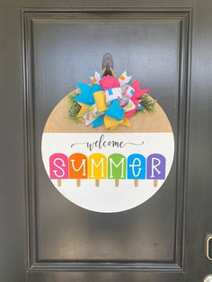 a welcome sign on the front door of a house that is decorated with colorful paper stars