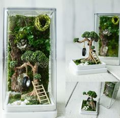 the miniature tree is made out of moss and has a ladder to climb up it