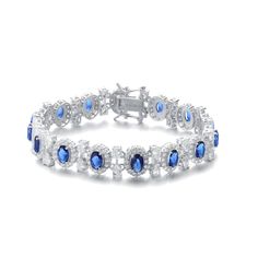 Bright and icy clear cubic zirconia contrast nicely with the large cubic zirconia in the center of each link in your choice of green or blue color options. The majestic bracelet is crafted of glistening White Gold Plated-plated in sterling silver Product should not come in contact with water Wipe to clean Sapphire Color, Box Clasp, Bracelet Online, Mens Jewelry Bracelet, Fine Earrings, Blue Bracelet, Heart Jewelry, Birthstone Jewelry, Gold Plated Sterling Silver