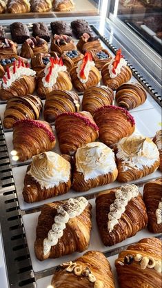 there are many different types of pastries on display