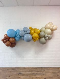 balloons are arranged on the wall in an office