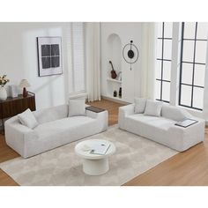 a living room with two couches and a coffee table