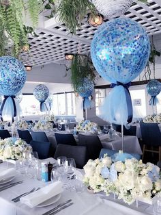 blue and white centerpieces in the shape of balloons