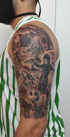 a man with a green and white striped shirt has a tattoo on his arm that features images of people