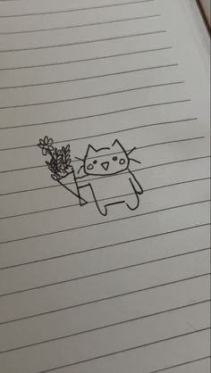 an open notebook with a drawing of a cat holding a plant