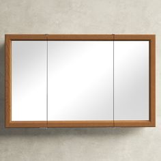 a mirror mounted to the side of a wall