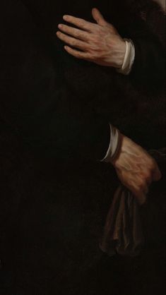 a close up of a painting of a person's hands