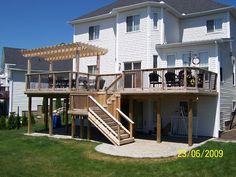 Deck With Stairs In Middle, Deck Stairs With Landing, Deck Stairs Landing, Deck Bars, Deck Bar, Raised Deck, Budget Remodel, Stair Landing