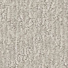 an up close shot of a carpet textured with light gray and white color scheme