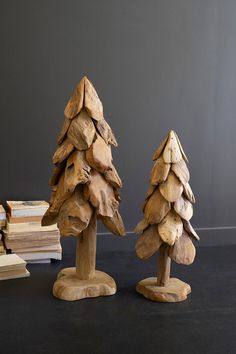 two small wooden trees sitting next to each other