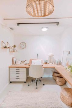 a home office with wicker lamps and rattan chairs on the desk, along with an area rug