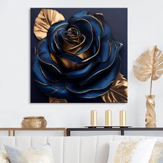 a blue rose with gold leaves on it in a white living room setting by the wall