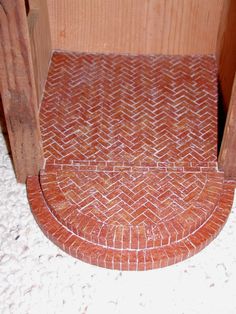 a close up of a red brick floor