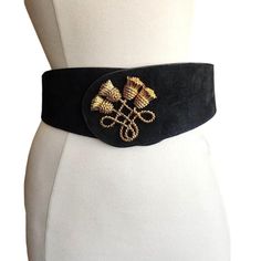 Vintage 80s Black Suede Belt Gold Tassel Embellishment Anne Klein II Black suede belt with curved edges, graduating at the front where there is an ornate, four tassel deisgn in three dimensional, gold toned metal. Closes with interior metal hooks into a series of holes at three adjustable settings.  label: Anne Klein II 1452 size: Medium / fits waists 29" - 31" condition: very good with no visible issues Suede Belt, Metal Hooks, Suspender Belt, Anne Klein, Suspenders, Gold Tone Metal, Black Suede, Tassels, Embellishments