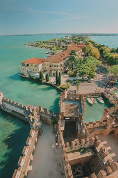 an aerial view of some buildings and water