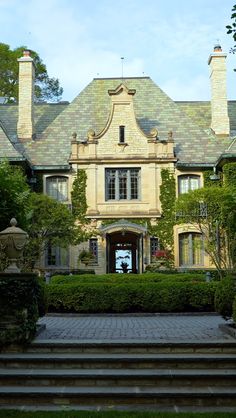 a large house with steps leading up to it