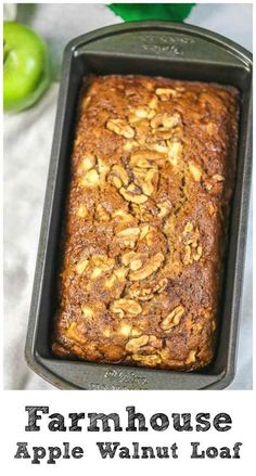 an apple bread in a pan with the words farmhouse apple walnut loaf