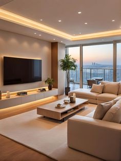 a living room filled with furniture and a flat screen tv mounted to the side of a wall